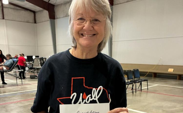 Glenda Rasco participated in the Lampasas community blood drive, held Nov. 11 at First Street Church of Christ’s Family Life Center. She displays the certificate she earned, signifying she has reached the 4-gallon mark for her blood donations. couartesy photo