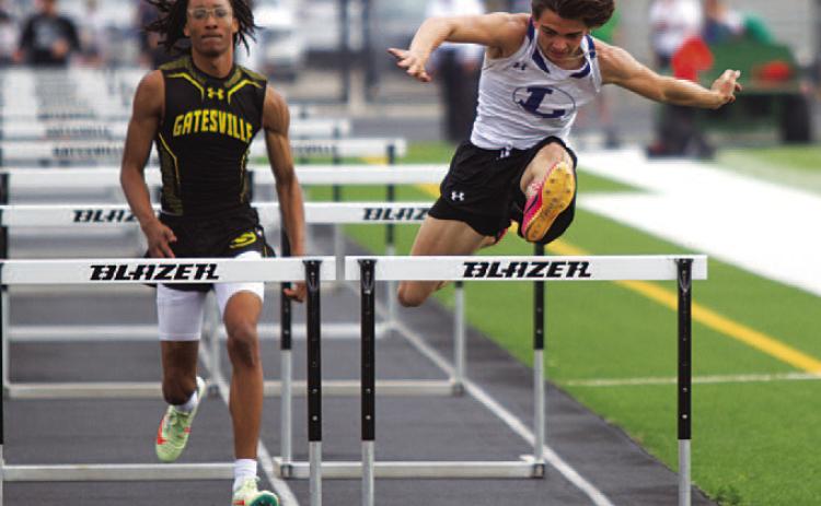 Asa White leaps over the final hurdle during the 110-meter race where he placed fourth last week. HUNTER KING | DISPATCH RECORD
