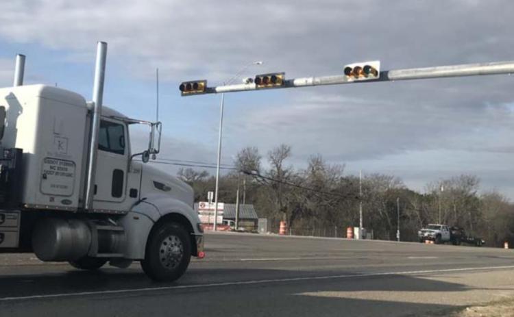 Vehicles pass by a traffic signal at U.S. Highway 190 and FM 2808 in Kempner earlier this week. MONIQUE BRAND | DISPATCH RECORD