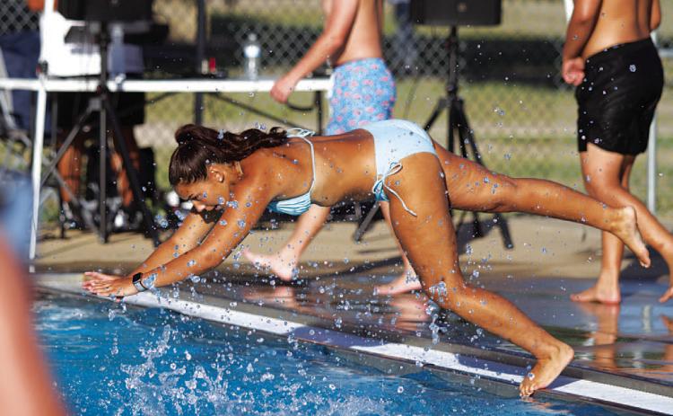 HUNTER KING | DISPATCH RECORD Charlie Freese dives into the deep end of Hanna Springs Pool during the Back to School Bash last Friday evening.