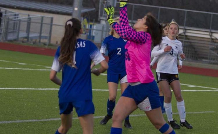 Goalkeeper Keona Cartwright makes a save in the Lady Badgers’ home match against Gatesville, while Nyla Long (4) assists on defense. JEFF LOWE | DISPATCH RECORD