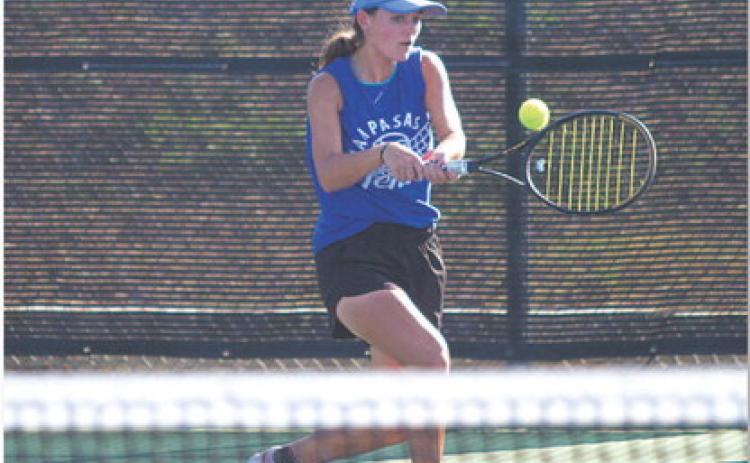 Caroline White hits a backhand during her doubles match with Allison Valdez. HUNTER KING | DISPATCH RECORD