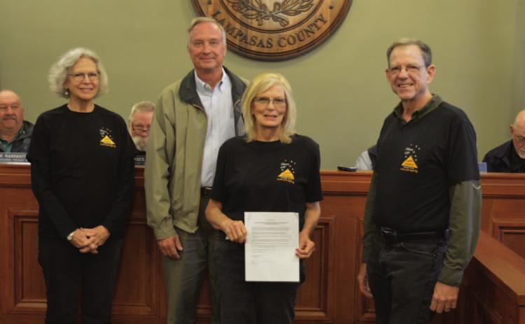 Members of Lampasas County Friends of the Night Sky pose for a photo with the Lampasas County Commissioners Court, which approved a proclamation to name February 2023 “Night Sky Awareness Month.” Standing are, from left to right, Night Sky committee member Jane Watson, County Judge Randy Hoyer, and Night Sky committee members Dorothy Person and Mike Watson. ERICK MITCHELL | DISPATCH RECORD