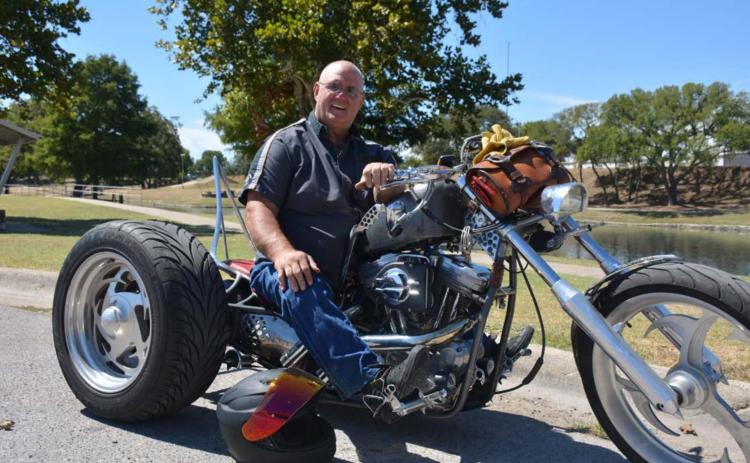 Lampasas native David Wear poses at W.M. Brook Park with his custom ride ‘Addiction,’ built by Wear himself. MONIQUE BRAND | DISPATCH RECORD