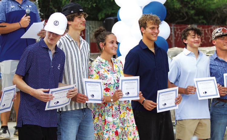 Badger baseball players and trainers show off their certificates on Monday evening. HUNTER KING | DISPATCH RECORD