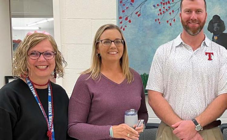 Clay Phillips of Farm Bureau Insurance was on hand to honor October educators of the month at Taylor Creek Elementary School. Each received a Texas Farm Bureau insulated mug and a Mojo’s gift card. Pictured with Phillips are Principal Shona Moore and Jennifer Hughes, Teacher of the Month. courtesy photo