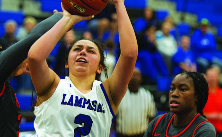 HUNTER KING | DISPATCH RECORD Johnnie Lewis fights through contact for a tough finish against Leander Glenn on Tuesday.