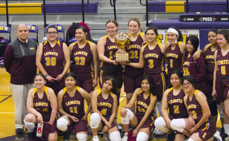 The Lometa Lady Hornets celebrate a bi-district championship victory over Gustine in Early on Saturday.