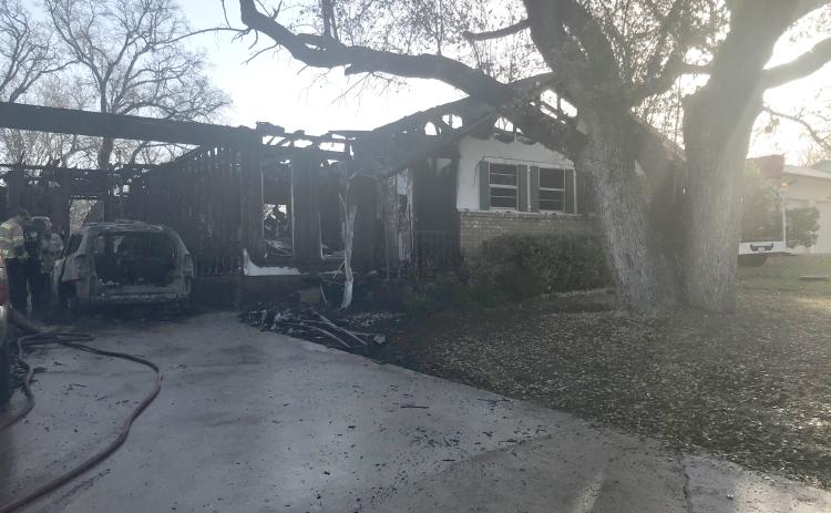 A fire early Monday morning severely damaged a house on Snell Drive. The blaze displaced four people and killed three pets. | Photo by Monique Brand