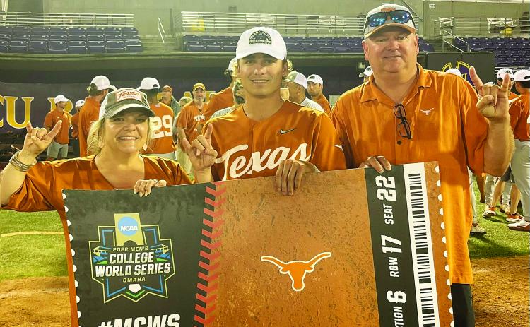 Kenna Whitehead, left, Ace and his dad Kirk Whitehead hold the Longhorns ticket to Omaha after the game three victory. COURTESY PHOTO