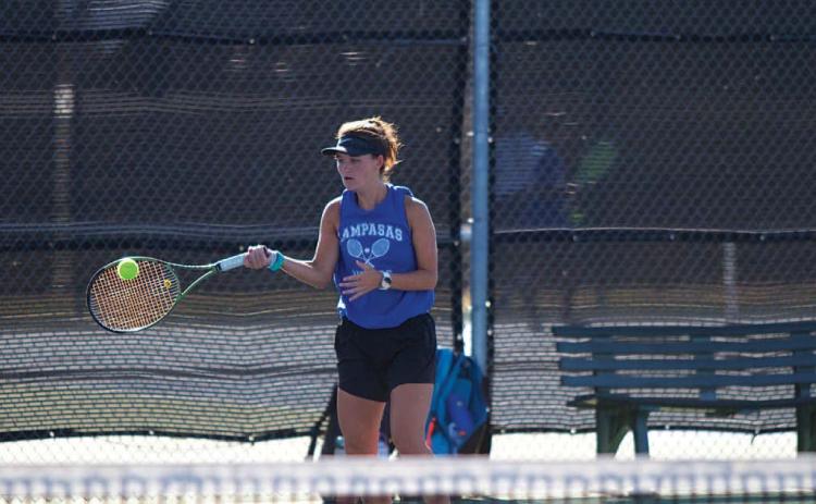 Caroline White plays a forehand shot during her doubles match against Gatesville.