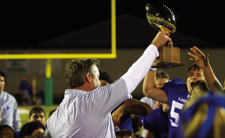 Lampasas head coach Troy Rogers celebrates the Badgers’ bidistrict win over Pecos last week. Tonight, the team will take on Dumas in an area-round matchup. Game time is 6 p.m. at the stadium in Andrews.