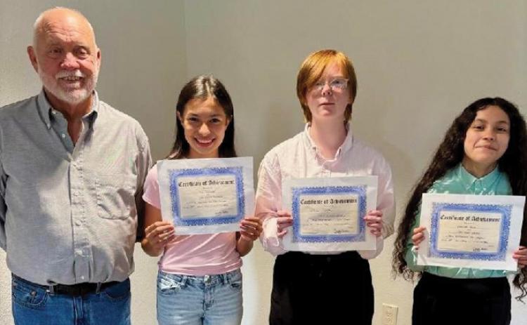 Texas history teacher James Best helped recognize his students who were named winners of the DRT Essay Contest on “Three flags over Texas.” With him are, from left to right, second-place winner Mia Summer, first-place winner Willow White and third-place winner Esmeralda Olalde. Not pictured: fourth-place winner Brooklyn Jones. COURTESY PHOTO