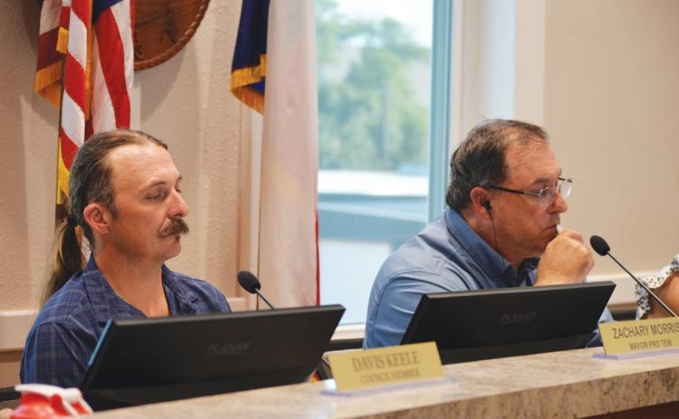 From left, Place 3 Councilman Zachary Morris and Mayor Herb Pearce look on during Monday's regular meeting. ERICK MITCHELL | DISPATCH RECORD