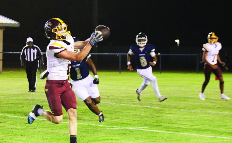 Easton Hamilton looks in a pass from Ulises Caso-Prado during Lometa’s win on Friday. MASON HINES | DISPATCH RECORD