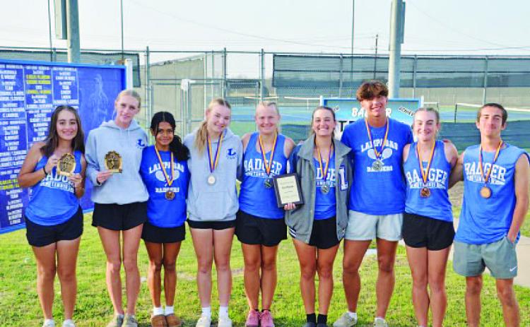 The tennis team shows off their medals from Marble Falls. HUNTER KING | DISPATCH RECORD