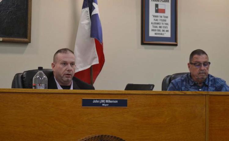 Mayor John Wilkerson, at left, and Councilman Rob Green listen to administrative reports during Tuesday night’s Kempner City Council meeting. ERICK MITCHELL | DISPATCH RECORD