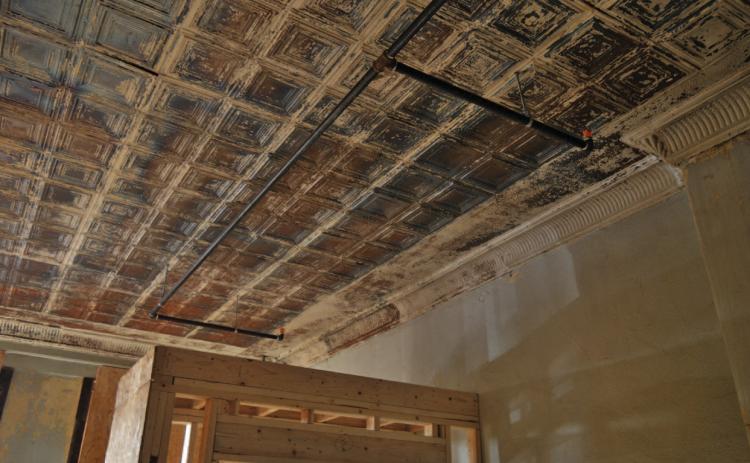 ERICK MITCHELL | DISPATCH RECORD The pressed tin ceiling inside the building at 511 E. Third St. convinced Austin native Myra Barlin to purchase and renovate the structure on the Lampasas courthouse square. See related, photo p. 10.