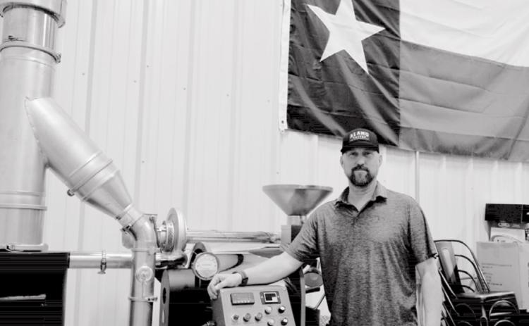 Alamo Coffee Company owner Aaron Cornish stands by a roasting machine in Alamo’s Lampasas warehouse. The machine will move to Alamo’s café so customers can observe the roasting process. MADELEINE MILLER | DISPATCH RECORD