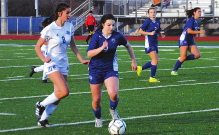 Bella Lindsey dribbles past a Jarrell defender down the right wing during the Lady Badgers’ win on Tuesday. HUNTER KING | DISPATCH RECORD