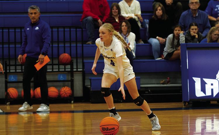 Adalya White dribbles up top during the Lady Badgers’ win on Tuesday. HUNTER KING | DISPATCH RECORD