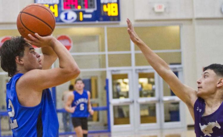 Tak Stinnett shoots from the perimeter against Marble Falls on Thursday. JEFF LOWE | DISPATCH RECORD