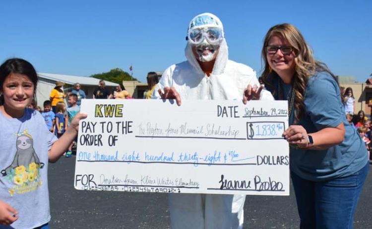 Kline Whitis Elementary School students raised more than $1,800 for the Peyton Jones Memorial Scholarship that will help two Lampasas High School students further their college education. Pictured are Jones’ 8-year-old sister Evalynn Seward, Principal Leanne Bobo and Jones’ mother, educator Shante Seward. The LHS student died of leukemia in 2018. MONIQUE BRAND | DISPATCH RECORD