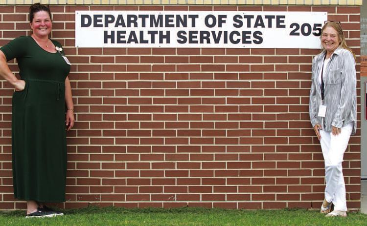 From left, Department of State Health Services staff at the Lampasas clinic, nurse Dee Edwards and specialist Tammy Pastor, pose for a photo outside the building located at 205 Water Street. ERICK MITCHELL | DISPATCH RECORD