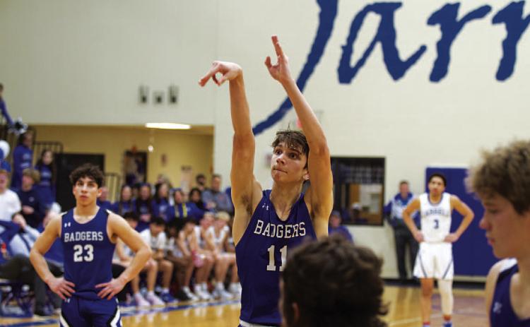 HUNTER KING | DISPATCH RECORD Luke Shivers releases a free throw for one of his 10 points in Tuesday’s game.