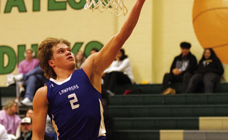 HUNTER KING | DISPATCH RECORD Haegan Oncken lays the ball up during the second half against Taylor.