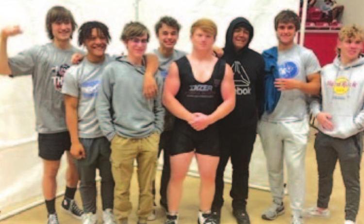 The powerlifting team poses together after competing at the regional meet last week. COURTESY PHOTO