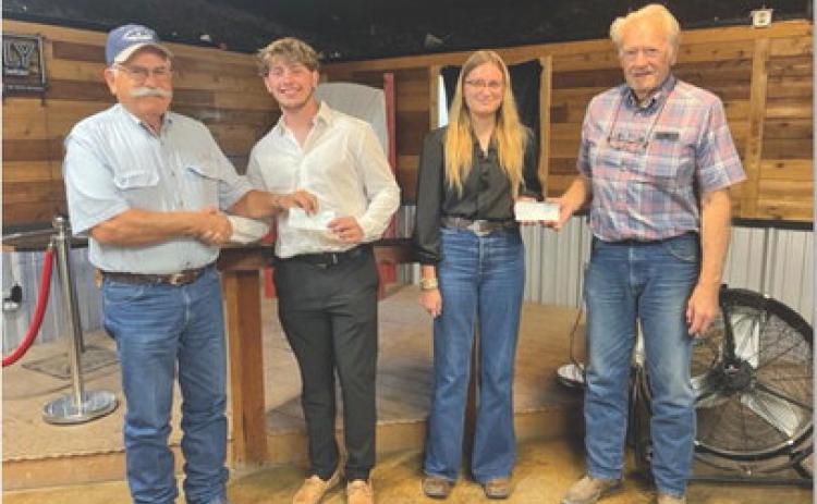 courtesy photo Lampasas Pilots Association offered its first scholarship awards at a recent meeting. Pictured, left to right, are pilots association member Rusty Knox, scholarship co-recipients Koh Stapp and Delanie Smith, and pilots association member Gordon Thornton.