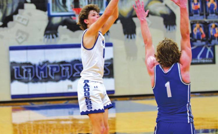 Nate Borchardt shoots over a Whitney defender in the Badgers’ home game last month. HUNTER KING | DISPATCH RECORD