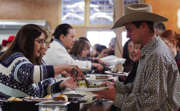 ADAM BARRIOS | DISPATCH RECORD Before the premium sale, attendees were served a steak dinner during Saturday evening’s activities.