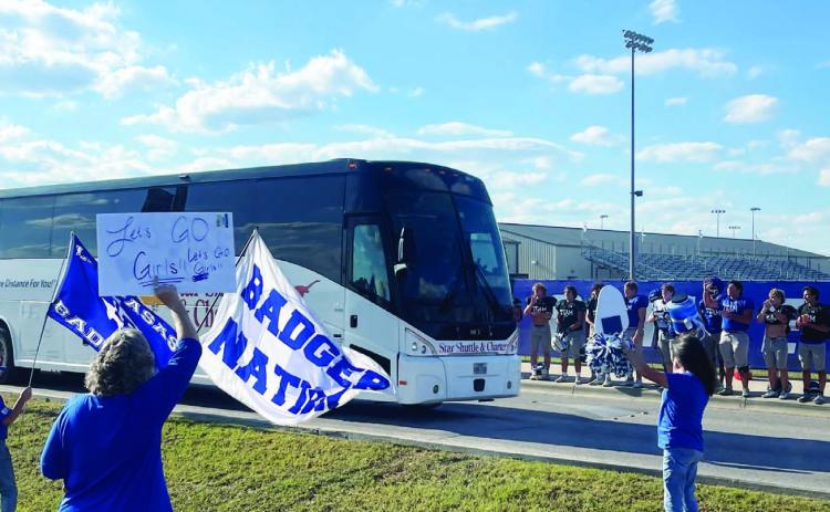 Members of the community and the Badger football team send off the volleyball team to Liberty Hill for their playoff game.