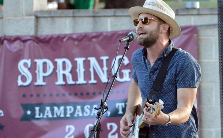 Zach Huckabee, a 2003 Lampasas High School graduate, performs “Real Small Town” by Adam Hood during the Spring Ho Hayloft Party on Tuesday in W.M. Brook Park. See related photos on page 7. JEFF LOWE | DISPATCH RECORD