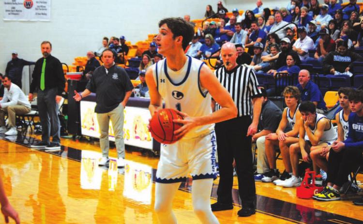 Kaeden Crawford squares up in front of an Iowa Park defender before driving to the basket for a layup. HUNTER KING | DISPATCH RECORD
