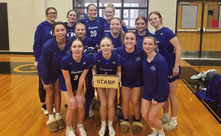 COURTESY PHOTO The Lady Badgers pose with the STAMP award at the Brady tournament.