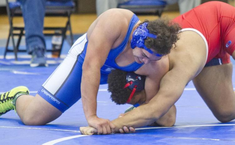 Anthony Harris, left, won all three matches at home on Saturday, including this one against Georgetown East View. JEFF LOWE | DISPATCH RECORD