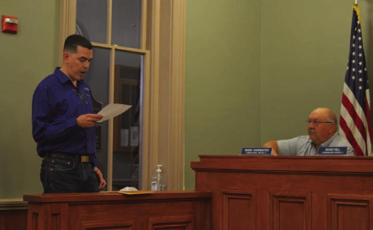 Derrick Berrios, director of the Lampasas County Higher Education Center, speaks to the Lampasas County Commissioners Court to provide an update on course offerings and vocational programs available. Pictured at right is Precinct 4 Commissioner Mark Rainwater. ERICK MITCHELL | DISPATCH RECORD