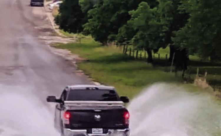 A pickup drives across the low-water crossing on South Willis in west Lampasas Tuesday. The county has received more than five inches of precipitation this month. COURTESY PHOTO