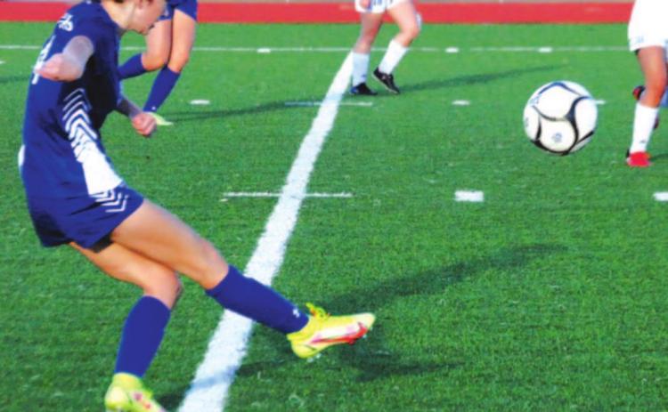 Nyla Long puts in a cross from the right wing during the Lady Badgers’ first district win over Jarrell. HUNTER KING | DISPATCH RECORD