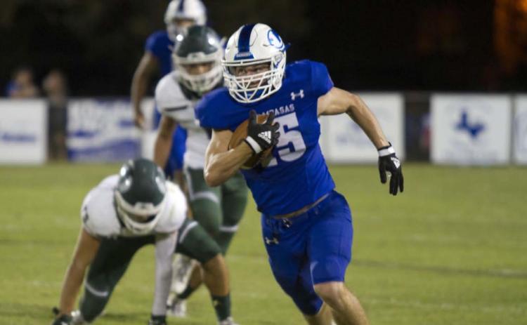 HUNTER KING | DISPATCH RECORD Case Brister breaks loose in the Taylor secondary during the Badgers’ 70-20 win last Friday.