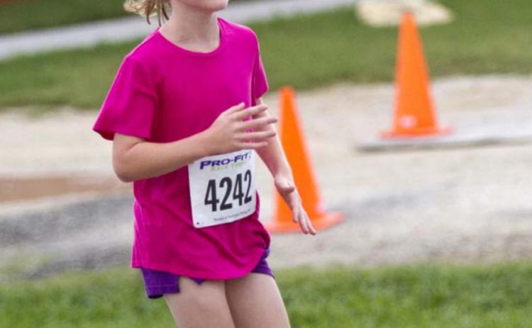 2016 Little Miss Spring Ho Vivien Martin won the female division of the one-mile race. JEFF LOWE | DISPATCH RECORD