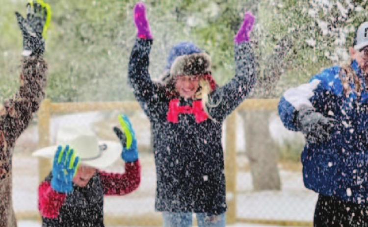 Youth enjoy playing in the snow