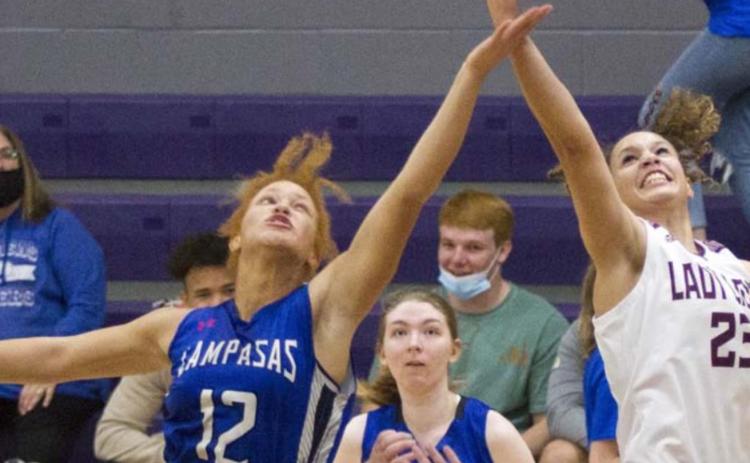 First-team all-district pick Juliana Dwamena (12) stretches for control of the ball in a play-in game against Brownwood. Taylor Allen, in middle, was a second-team all-district selection. JEFF LOWE | DISPATCH RECORD