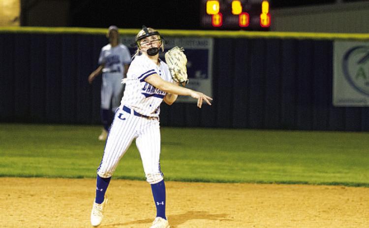 HUNTER KING | DISPATCH RECORD Brady Burton throws to first base to record an out against Taylor.