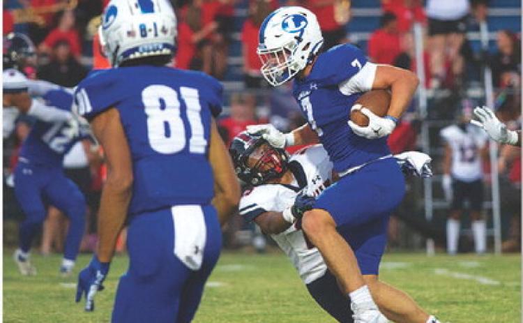 Jett Walker stiff arms an East View defender. The sophomore ran for 166 yards and two touchdowns. HUNTER KING | DISPATCH RECORD