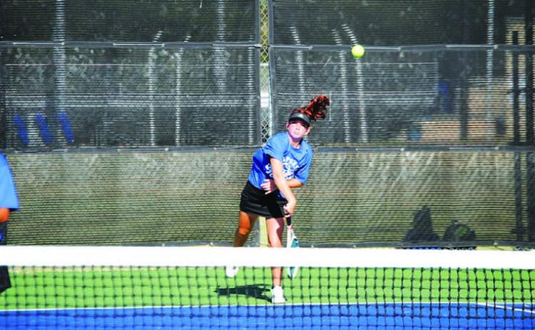 Allison Valdez serves during her doubles match against Gatesville. HUNTER KING | DISPATCH RECORD