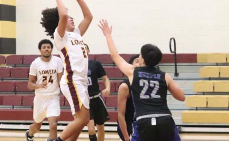 Tim Juarez goes up over a San Angelo Lakeview defender during the Hornets’ loss last week. JESSICA MALDONADO | DISPATCH RECORD
